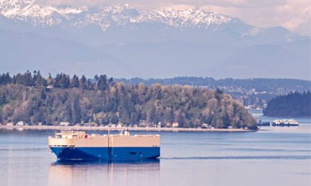 PHOTOS: Debris recovery ship, ferry boat & setting Moon seen from Burien