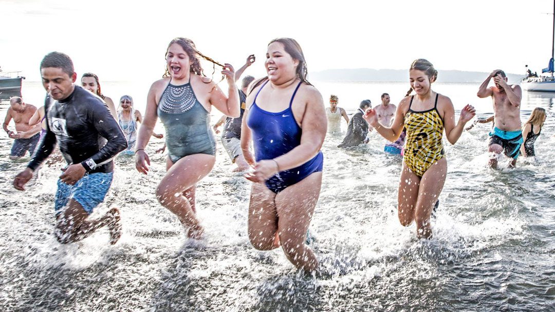 VIDEO/PHOTOS: Dozens brave Polar Bear Plunge to bring in the New Year